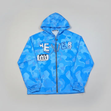 Blue camouflage jacket with text on a beige surface